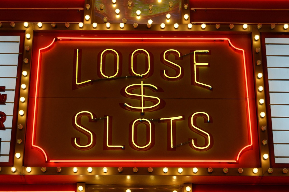 AG Gaming online slots machines glowing with neon lights at a Singapore casino